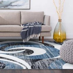 Wyatt Abstract Blue 9 ft. x 12 ft. Indoor Area Rug by Tayse Rugs -Malibu Wide Plank Shop blue tayse rugs area rugs wyt1206 9x12 fa 1000