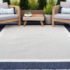 Eco Solid Border Navy 5 ft. x 8 ft. Indoor/Outdoor Area Rug by Tayse Rugs -Malibu Wide Plank Shop navy tayse rugs outdoor rugs eco1205 5x8 31 1000